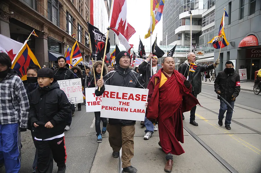TORONTO - MARCH 10: Buddhist Monks marching in a rally organized to protest against the Chinese occupation of Tibet on March 10 2009 in Toronto, Canada.